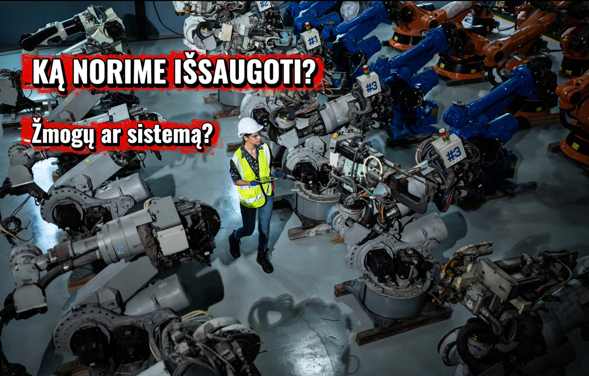 Robotizuota gamykla su užrašu „KĄ NORIME IŠSAUGOTI? Žmogų ar sistemą?“
